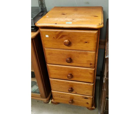 A modern pine five height chest of drawers, another pine glazed door record player cabinet 