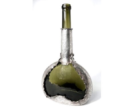 An Arts and Crafts style green long neck glass wine flask with chased white metal mounts stamped "Townsend &amp; Co with regi