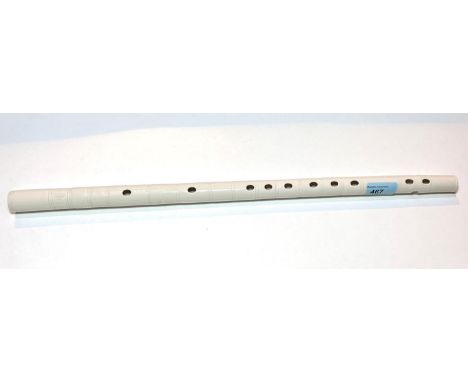 An unusual Chinese Blanc de Chine ceramic flute with ribbed bamboo like body, incised decoration to both ends, ht. 53.5cm.  O