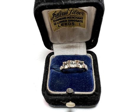 3 stone Csarite lady's dress ring with white zircons to shoulders, in 9 k gold setting, 2gm., size L/M 