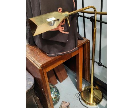 An adjustable gilt metal standard/reading lamp 