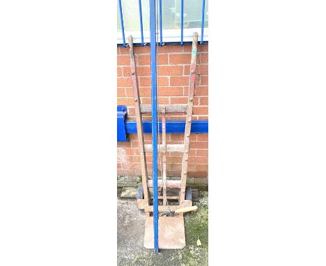 A vintage wooden luggage trolley wood and metal, a vintage long handle branch cutter 