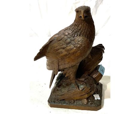 A Black Forest style carved wood eagle, height 27cm; a selection of vintage OS & Bartholomew maps Loss of one claw to foot re