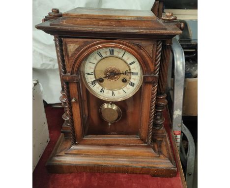 A mahogany mantel clock with chiming movement 