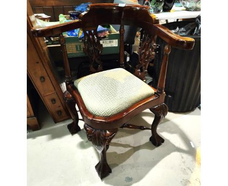 a Chippendale style mahogany corner armchair with pierced and carved splats, drop in seat cabriole legs with ball and claw fe