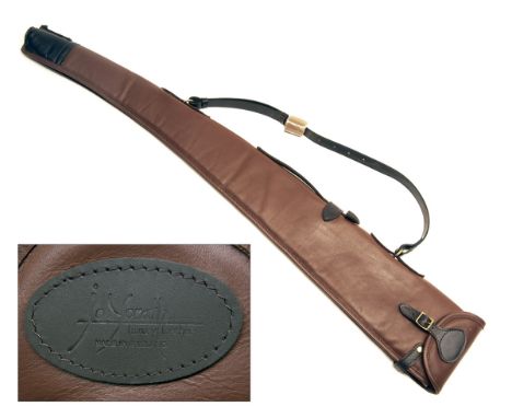 JOANNE YORATH A NEW AND UNUSED CHESTNUT LEATHER FLEECE-LINED SINGLE GUNSLIP, with leather shoulder strap and brass fittings, 