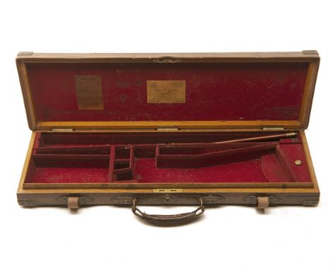 JAMES PURDEY &amp; SONS A BRASS-CORNERED OAK AND LEATHER SINGLE GUNCASE, fitted for 30in. barrels, the interior lined with re