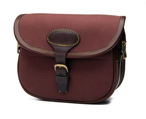 FREDERICK BEESLEY A NEW AND UNUSED CANVAS AND LEATHER CARTRIDGE BAG, with canvas and leather shoulder strap and brass fitting