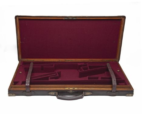 A BRASS-CORNERED OAK AND LEATHER DOUBLE GUNCASE, fitted for 28in. maroon baize (could adapt to 31in.) the interior lined with