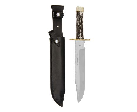 R. COOPER, SHEFFIELD A MASSIVE CUSTOM BOWIE-KNIFE, with 12in. clip-point blade false edged for the last 4 1/2in., scalloped b