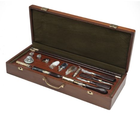 A NEW AND UNUSED CASED PRESENTATION DELUXE GUN 12-BORE CLEANING KIT, consisting cleaning rod, cleaning heads, snap-caps, oil 