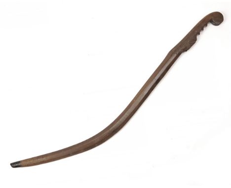 AN INTERESTING CARVED CRETIAN OLIVE-WOOD FIGHTING STICK or 'SWORD OF THE POOR', circa 1840-50, 37in. overall with carved curv