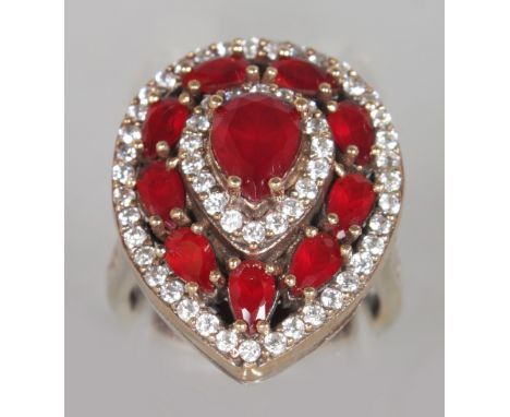 A SILVER, RUBY AND BRILLIANT SET TEARDROP RING.  
