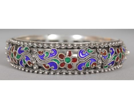A RUSSIAN DESIGN SILVER AND ENAMEL BANGLE.  