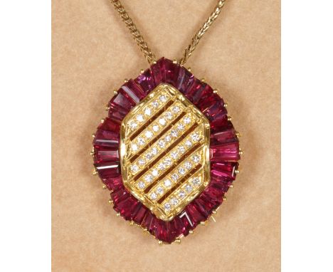 A LOVELY RUBY AND DIAMOND SET BROOCH PENDANT on an 18CT yellow gold chain.  