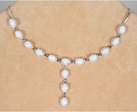 A LOVELY SILVER GILSON OPAL NECKLACE AND DROP, set with fourteen Gilson opals.  