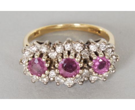 A GOOD 18CT GOLD, RUBY AND DIAMOND TRIPLE CLUSTER RING.  