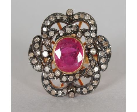 A 14CT GOLD AND SILVER SET RUBY AND OLD CUT DIAMOND RING.  