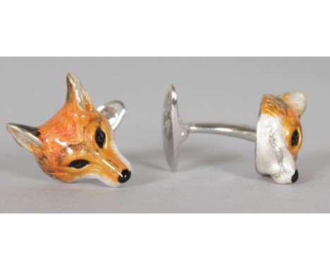 A PAIR OF STERLING SILVER AND ENAMEL FOXES' HEAD CUFFLINKS.  