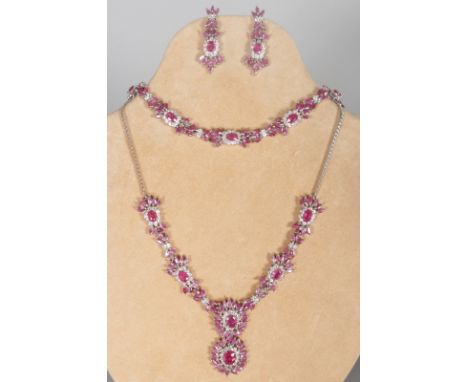 A SUPERB REAL RUBY THREE PIECE SET, comprising necklace, bracelet and earrings.  