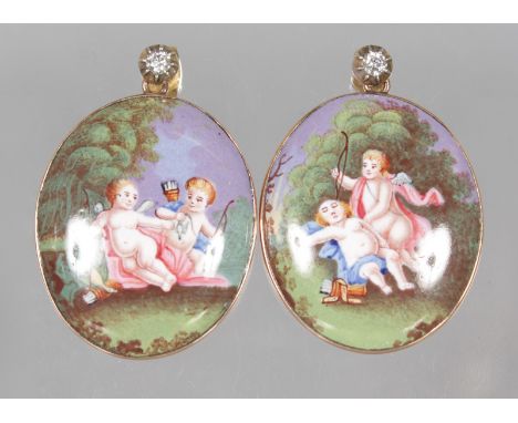 A LOVELY PAIR OF ANTIQUE DIAMOND AND ENAMEL OVAL EARRINGS decorated with cupids.  