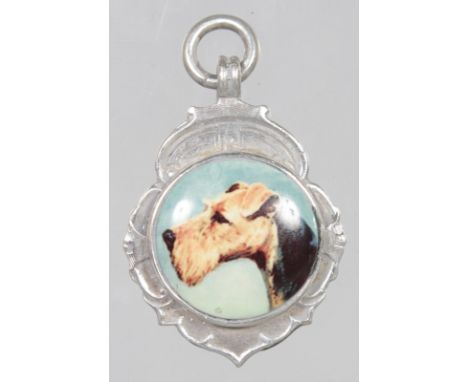 A 1935 BIRMINGHAM SILVER AND ENAMEL TERRIER FOB.  