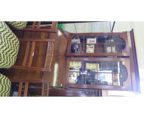An Edwardian mahogany and chequer line inlaid bureau bokcase, the moulded cornice over glazed doors, sloping fall enclosing a