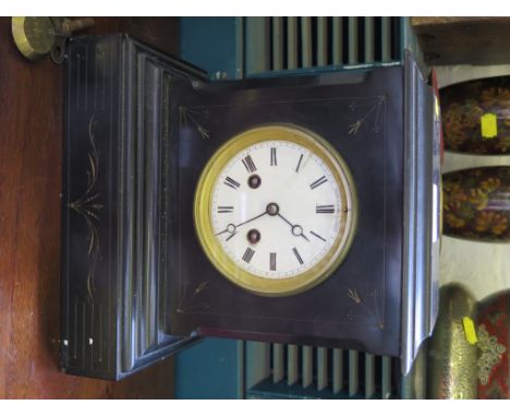 A Victorian slate mantel clock, with enamel dial and Henry Marc movement striking on a bell, 26cm high 