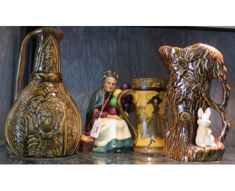 A Royal Doulton figure - The Old Balloon Seller, HN1315, a Royal Doulton Morrisian jug, a Sadler Inca style ewer and a Sylvac