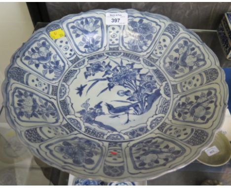 Hatcher Cargo: A blue and white Kraak dish, the central panel depicting a bird and insect within bird and floral panels 29.5c