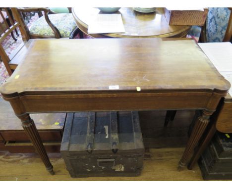 A Regency crossbanded mahogany fold over card table, in the manner of Gillows, with rounded corners, crossbanded frieze and r