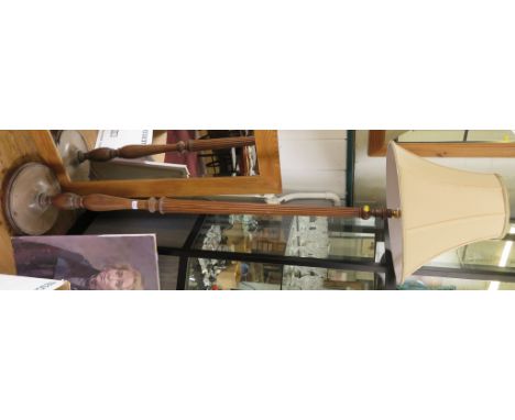A mahogany standard lamp, the reeded baluster stem on a circular base