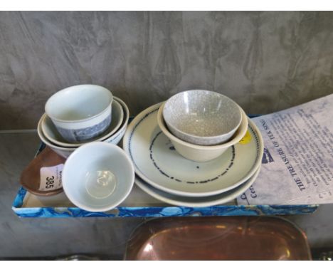 Tek Sing Treasures: Two blue and white teabowls, a plain white and a crazed teabowl, two saucers, and a brown glazed spoon, a