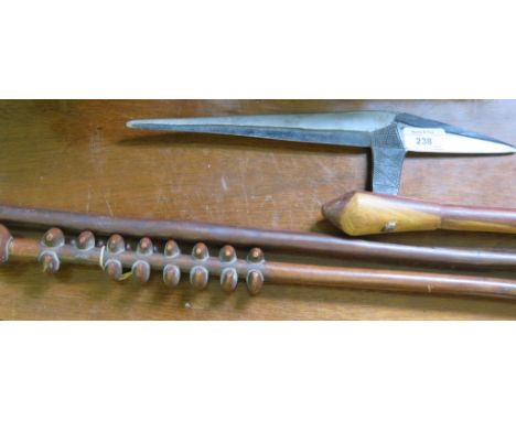 A tribal Lignum Vitae axe, possibly African, a knopped staff and a tribal spear (3)