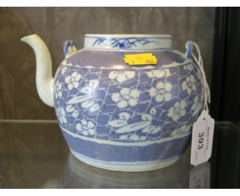 Desaru Shipwreck: A blue and white teapot with repeated floral pattern, lacks lid, with Nanhai Marine Archaeology labels, 11c