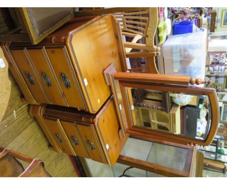 A pair of stained pine bedside drawers by Ducal Ltd - Chateau series, each with three drawers on ogee bracket feet 51cm, and 
