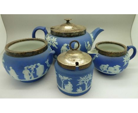 A three piece Wedgwood Jasperware tea service and one other sugar bowl
