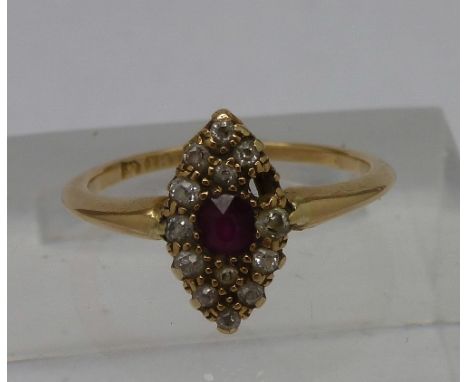 An 18ct gold, ruby and diamond navette shaped ring, weight 2.5g, size K, one stone missing