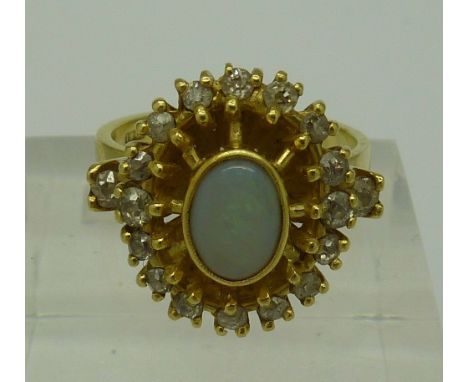 An 18ct gold, opal and diamond ring set with 18 diamonds, approximately .70 cts, weight 8.1g, size P