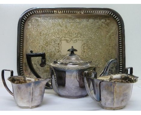 A plated three piece tea service and a tray