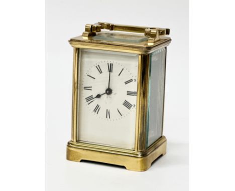 Richard &amp; Cie. A Late 19th Century French brass carriage clock. With 5 bevelled glass panels. 7.5x7x12cm