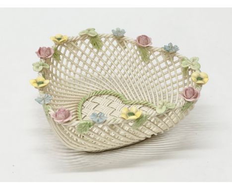 A Belleek Pottery woven basket. 16x16x6cm