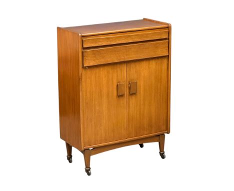 A Mid Century teak buffet side cabinet. With cutlery drawers and lower cupboard. C.1970. 76.5x37.5x105.5cm