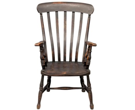 An elm and beech armchair. C. 1880. A 19th Century Victorian chair with a sweeping comb back. (2)