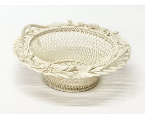 A Belleek Pottery woven basket. 21x21x8cm