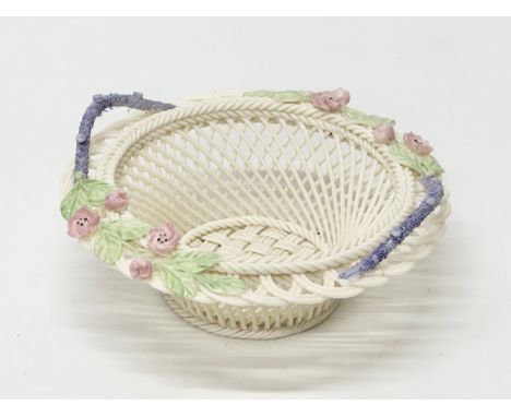 A Belleek Pottery woven basket. 15x15.5x6.5cm