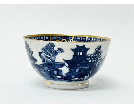 A Chinese Export tea bowl. Qianlong Period (1735-1796) 18th Century. Blue and white Pagoda, Mountain and Seascape Scene, with