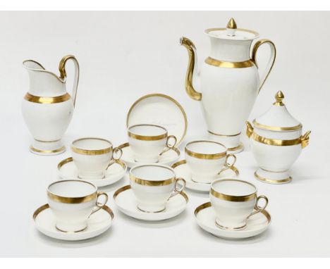 A French Empire coffee service. Early 19th Century. C.1810-1830. Old Paris Porcelain. Gilt rimmed and borders on an ivory whi