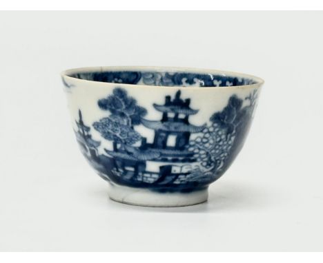 A Chinese tea bowl. Qianlong Period (1735-1796) 18th Century. Underglaze blue and white landscape scene, featuring pagodas, c