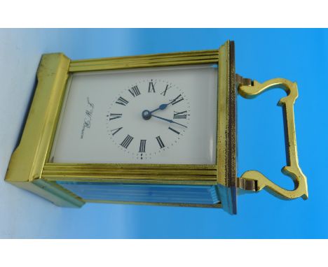 A J.W. Benson brass and four glass sided carriage clock, height of case 11cm